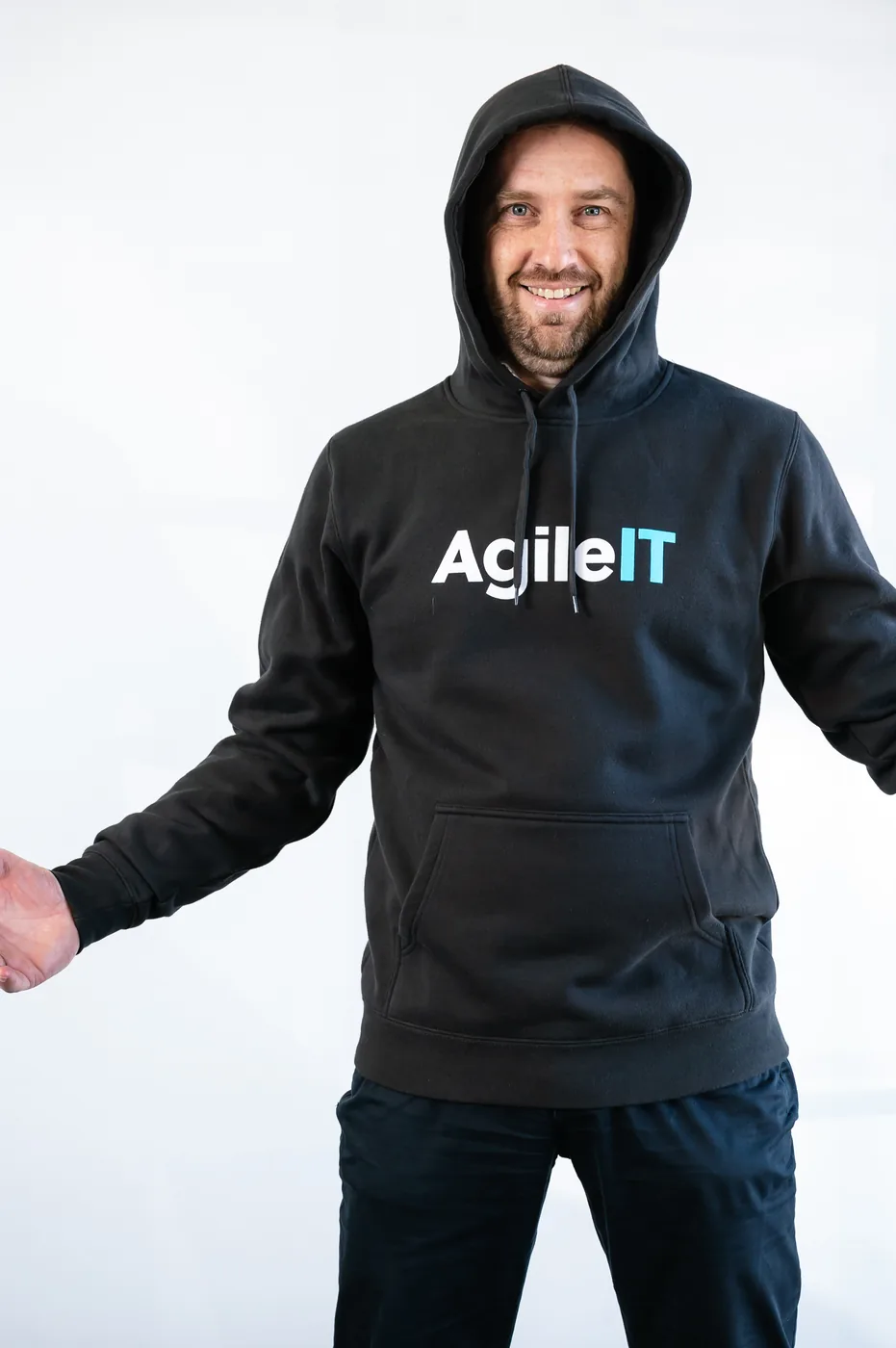 Linden Jackson, founder of Agile IT, in a relaxed hoodie portrait.