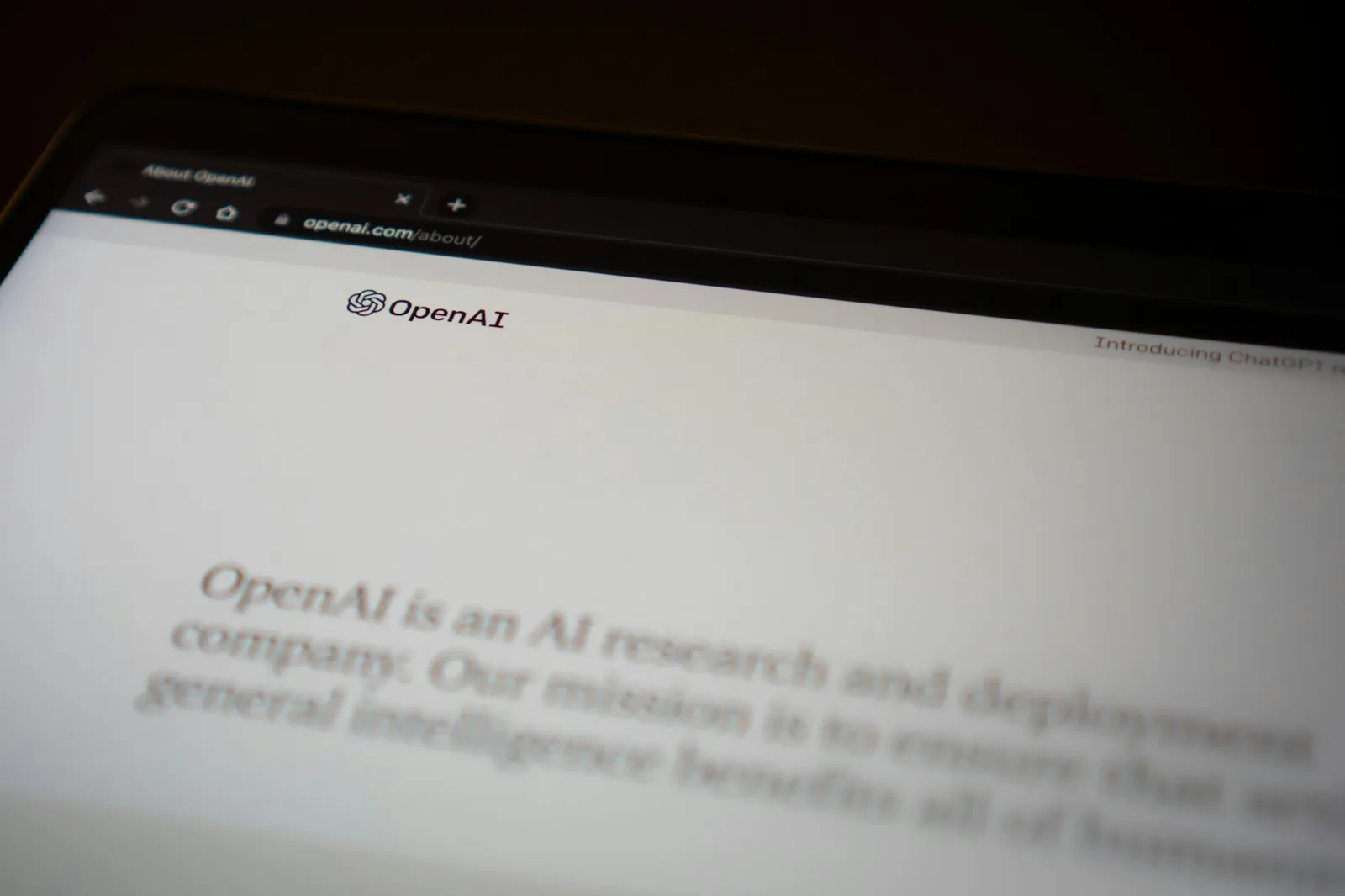 OpenAI website displayed on a laptop, modern AI tools in everyday business use