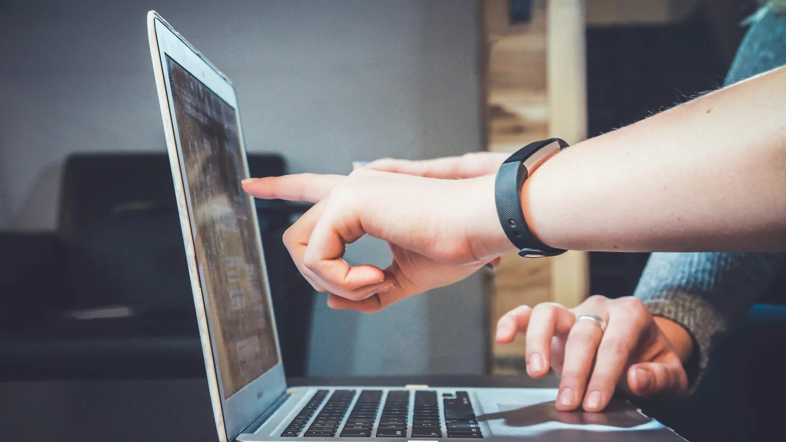 A team member working at a laptop, the Dijital Team partnership extending Agile IT capacity. Photo by John on Unsplash.