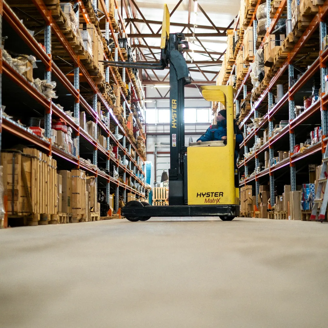 A forklift in a warehouse, representing the Dandenong South manufacturing and logistics precinct. Managed IT for South East Melbourne.
